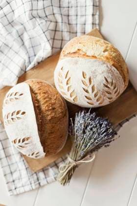 Freshly baked bread with dry lavender flowers on table property released, ONAF00484