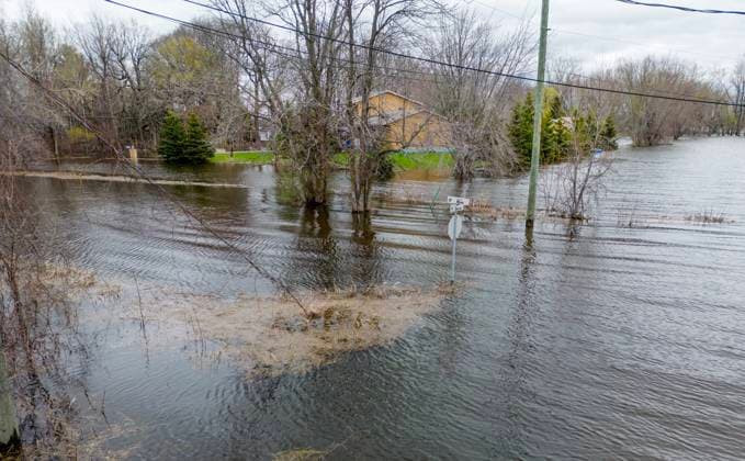 April 30, 2023, Rigaud, PQ, CANADA: Homes along the Ottawa river in the town of Rigaud, Que., just west of the island of Montreal, are on high alert with a total of 30 to 50 millimeter s of rain expected from Sunday evening into Monday. Homes are already threatened by high water levels that are encroaching onto local roads along the river on Sunday, April 30, 2023. Rigaud CANADA  - ZUMAc35_ 20230430_zaf_c35_026 Copyright: xPeterxMccabex
