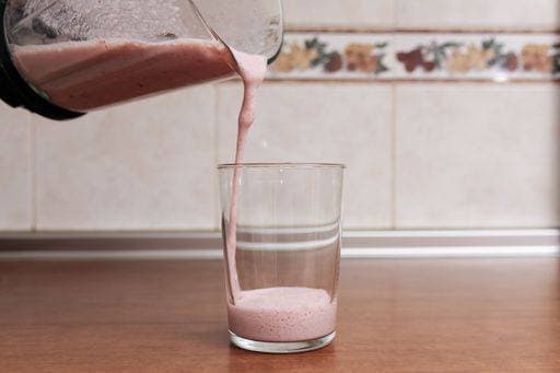 RECORD DATE NOT STATED A beautiful shot of delicious strawberry milk poured in a transparent glass *** einer Schönes erschossen des Köstlich Erdbeere Milch eingeschenkt ÊIn einer durchsichtig Glas 329220
