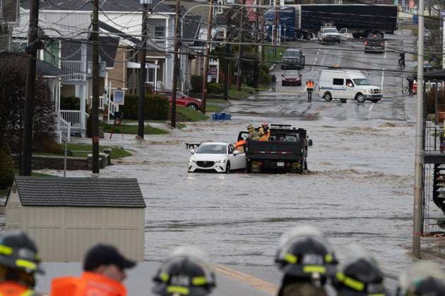 May 1, 2023, BAIE SAINT-PAUL, PQ, CANADA: A driver is evacuated from his flooded car near a bridge Monday, May 1, 2023 in Baie Saint-Paul, Quebec. In Baie-St-Paul, Que., around 90 kilometres northeast of the provincial capital, the mayor declared a state of emergency due to heavy rains that washed away roads and isolated homes. BAIE SAINT-PAUL CANADA - ZUMAc35_ 20230501_zaf_c35_086 Copyright: xJacquesxBoissinotx