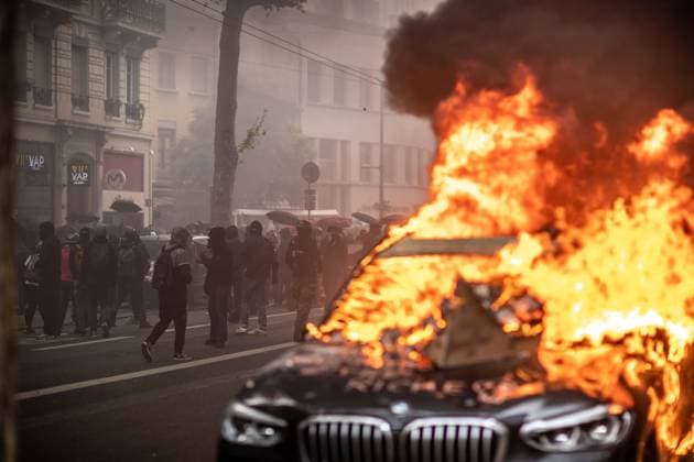 May Day Demonstration In Lyon, France Protesters are burning car tagged with graffiti reading Don t be rich during a demonstration on May Day to mark the international day of the workers, about month after the government pushed an unpopular pensions reform act through parliament, in Lyon, France, on May 1, 2023. Lyon France  Copyright: xEmrahxOprukcux originalFilename: oprukcu-notitle230501_nprII.jpg