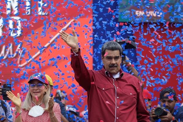 Pro-government March For The International Workers Day In Caracas, Venezuela President Nicolas Maduro with his wife Cilia Flores greets supporters during a march to commemorate international workers day in Caracas, Venezuela, May 1, 2023. Caracas Venezuela  Copyright: xJavierxCamposx originalFilename: campos-notitle230501_npfLm.jpg