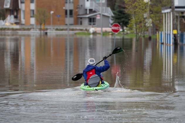 May 4, 2023, Gatineau, PQ, Canada: A resident uses a kayak to make their way through flooding in the Gatineau region of Gatineau, Que. on Thursday, May 4, 2023. Flood warnings are in effect for the national capital region following significant rainfall and increased water runoff. Gatineau Canada  - ZUMAc35_ 20230504_zaf_c35_137 Copyright: xSpencerxColbyx