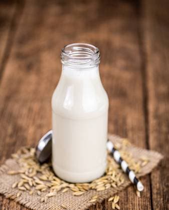 Portion of healthy Oat Milk on an old wooden table (selective focus; close-up shot) Healthy Oat Milk on a wooden table as detailed close-up shot (selective focus) Copyright: xZoonar.com ChristophxSchönex 19857705