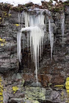 Creative Highlights World Icicles on a rock wall covered with lichen Icicles on a rock wall covered with lichen Copyright: xZoonar.com LubosxChlubnyx 19816531
