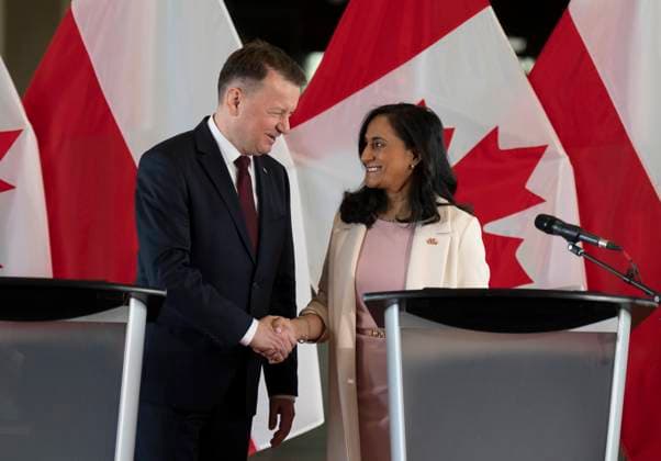 May 8, 2023, Ottawa, ON, Canada: Minister of Defence Anita Anand shakes hands with Polish Deputy Prime Minister and Minister of National Defence Mariusz BAöaszczak following a joint news conference at National Defence Headquarters, in Ottawa, Monday, May 8, 2023. Ottawa Canada  - ZUMAc35_ 20230508_zaf_c35_020 Copyright: xAdrianxWyldx