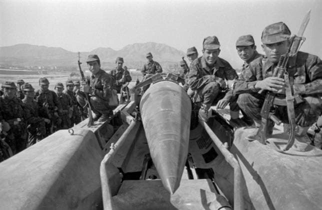 Withdrawal of Soviet troops from Afghanistan 8429312 15.02.1989 The Republic of Afghanistan (now the Islamic Emirate of Afghanistan). The Afghan War (1979-1989). Gradual withdrawal of the restricted contingent of the Soviet troops from Afghanistan. Soldiers pose for a photo with a mid-range missile (9K72 Elbrus tactical missile system with a 8K-14(R-17) missile). Andrew  Copyright: xAndrewx
