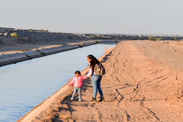 YUMA, AZ - MAY 11: Migrants seen set to cross the border at Cocopah Indian Reservation before Title 42 is set to end at 11:59pm allowing all migrants to apply for asylum after the three-year COVID-era health ban. Yuma, Arizona on May 11, 2023. Copyright: xDeeCeexCarterx