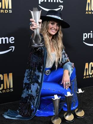Lainey Wilson shows off her four awards, Female Artist of the Year, Album of the Year for Bell Bottom Country plus Visual Media of the Year and Music Event of the Year at the Academy of Country Music Awards at The Star in Frisco, TX on Thursday, May 11, 2023.  FRS2023051148 IANxHALPERIN