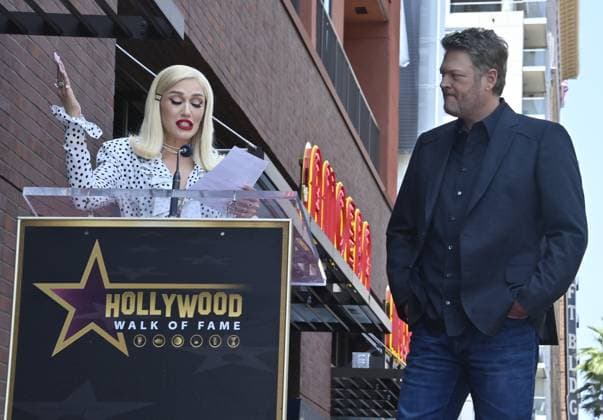 Singer and entertainer Blake Shelton ;listens to comments by his wife, singer Gwen Stefani during an unveiling ceremony honoring him with the 2,755th star on the Hollywood Walk of Fame on Friday, May 12, 2023.  LAP2023051222 JIMxRUYMEN