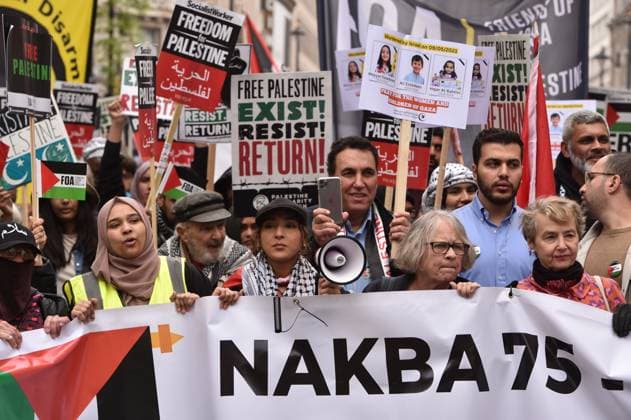 May 13, 2023, London, England, United Kingdom: Demonstrators march in support for Palestine in central London. Palestinians commemorate the 75th anniversary of Nakba Day, also known as the Palestinian Catastrophe, which involved the destruction of Palestinian society in 1948, as well as the continuing displacement of many Palestinian people from their homeland. London United Kingdom - ZUMAk172 20230513_zip_k172_031 Copyright: xThomasxKrychx