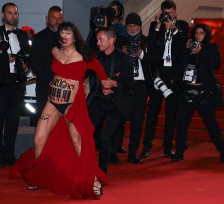 May 17, 2023, Cannes, Cote d Azur, France: A pregnant anti-Putin protester disturbs the red carpet arrivals ahead of the screening of Homecoming during the 76th Annual Cannes Film Festival Cannes France - ZUMAc179 20230517_zep_c179_205 Copyright: xMickaelxChavetx
