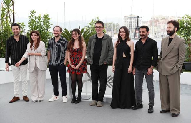 (230520) -- CANNES, May 20, 2023 -- Director Nuri Bilge Ceylan (4th R) poses with cast members during a photocall for the film Kuru Otlar Ustune (About Dry Grasses) at the 76th edition of the Cannes Film Festival in Cannes, southern France, May 20, 2023. The film Kuru Otlar Ustune (About Dry Grasses) will compete for the Palme d Or. ) FRANCE-CANNES-FILM FESTIVAL-KURU OTLAR USTUNE GaoxJing 