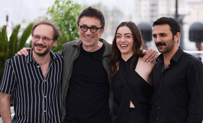 (230520) -- CANNES, May 20, 2023 -- Director Nuri Bilge Ceylan (2nd L) poses with cast members during a photocall for the film Kuru Otlar Ustune (About Dry Grasses) at the 76th edition of the Cannes Film Festival in Cannes, southern France, May 20, 2023. The film Kuru Otlar Ustune (About Dry Grasses) will compete for the Palme d Or. ) FRANCE-CANNES-FILM FESTIVAL-KURU OTLAR USTUNE GaoxJing 