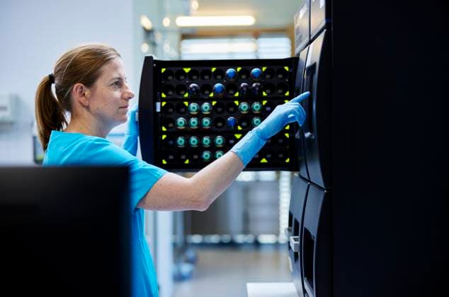 Scientist opening storage cabinet door in laboratory model released, Symbolfoto property released, CVF02393