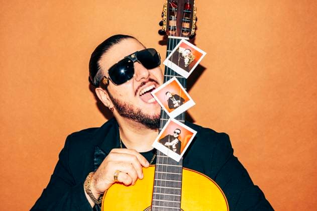 MR_ID13306_13123_JuanCarrasco.jpg, PR_ID13306_3354_FotosIstax.jpg Portrait of bearded male hipster in black jacket and sunglasses looking at camera while standing against orange background with acoustic guitar with photos in studio, Model released, Property released JoseLuisCarrascosa_ID13306_405803_034 Copyright: xJosexLuisxCarrascosax MR