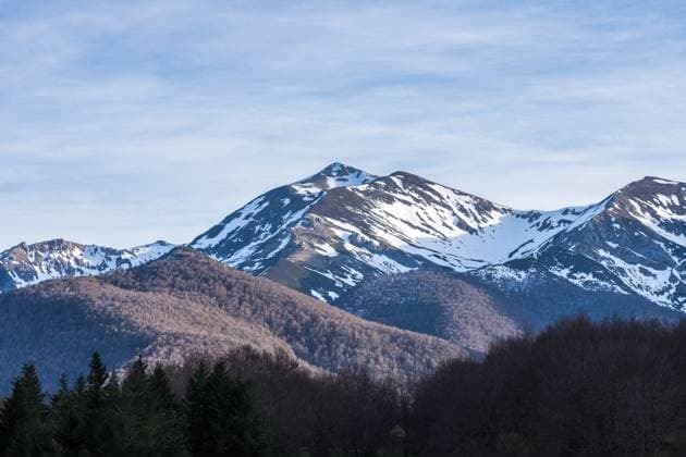 Majestic view of Picos de Europa mountain range and peaks covered by snow located under cloudy sky in Spain JuanLopez_ID13478_410176_024 Copyright: xJuanxLopezx Model Released