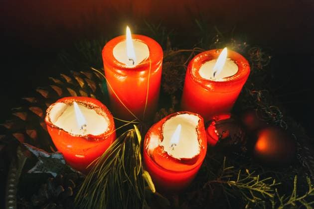 Composition of flaming red Christmas tapers placed between fir branches RobertKohlhuber_MiscAugust_28 Copyright: xRobertxKohlhuberx RECORD DATE NOT STATED Model Released