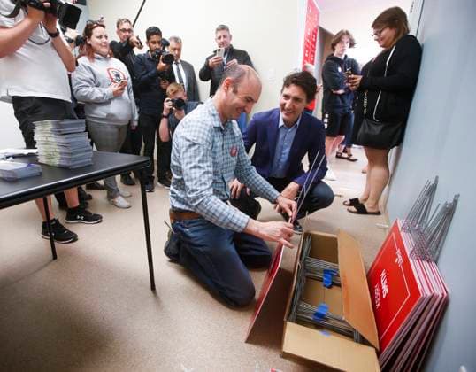 May 24, 2023, WINNIPEG, MANITOBA, CANADA: Prime Minister Justin Trudeau chats with Nikos Kioussis, campaign manager for Kerry Smith, as he makes election signs and greets supporters at a candidate rally in Portage La Prairie, Man. Wednesday, May 24, 2023. WINNIPEG CANADA  - ZUMAc35_ 20230524_zaf_c35_095 Copyright: xJohnxWoodsx