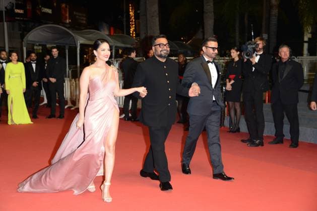 May 25, 2023, CANNES, France: CANNES, FRANCE - MAY 24: (L-R) Sunny Leone, Director Anurag Kashyap and Rahul Bhat attend the Kennedy red carpet during the 76th annual Cannes film festival at Palais des Festivals on May 24, 2023 in Cannes, France CANNES France - ZUMAi09_ 20230525_zaf_i09_011 Copyright: xFrederickxInjimbertx