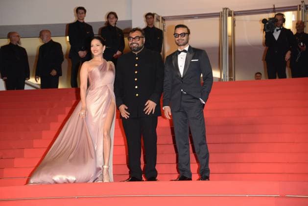 May 25, 2023, CANNES, France: CANNES, FRANCE - MAY 24: (L-R) Sunny Leone, Director Anurag Kashyap and Rahul Bhat attend the Kennedy red carpet during the 76th annual Cannes film festival at Palais des Festivals on May 24, 2023 in Cannes, France CANNES France - ZUMAi09_ 20230525_zaf_i09_013 Copyright: xFrederickxInjimbertx