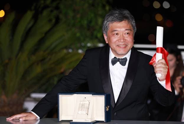 (230528) -- CANNES, May 28, 2023 -- Japanese director Kore-eda Hirokazu poses with the trophy during a photocall after he accepted the Best Screenplay award for the film Kaibutsu (Monster) on behalf of Japanese writer Sakamoto Yuji during the closing ceremony of the 76th edition of the Cannes Film Festival in Cannes, southern France, May 27, 2023. ) FRANCE-CANNES-FILM FESTIVAL-AWARDS GaoxJing 