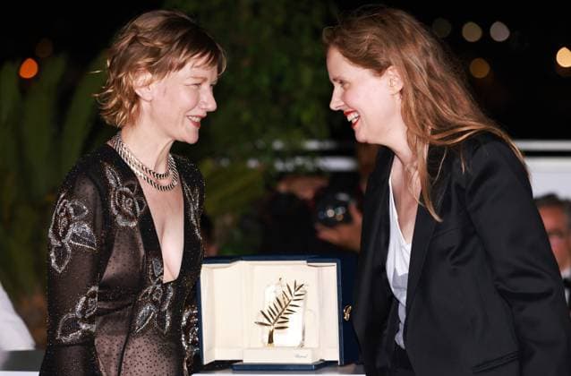 (230528) -- CANNES, May 28, 2023 -- French director Justine Triet (R) poses with the trophy with German actress Sandra Huller during a photocall after she won the Palme d Or for the film Anatomie d une Chute (Anatomy of a Fall) during the closing ceremony of the 76th edition of the Cannes Film Festival in Cannes, southern France on May 27, 2023. French director Justine Triet was awarded with the Palme d Or at the 76th Cannes Film Festival for her Anatomy of a Fall on Saturday in Cannes, France, becoming the third female director winning this top prize. ) FRANCE-CANNES-FILM FESTIVAL-PALME D OR GaoxJing 