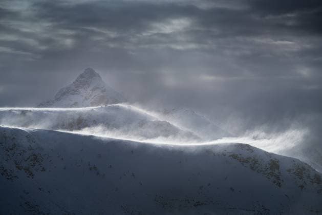 Creative Highlights World Snow blows from mountain ridges, Vestvagøy, Lofoten Islands, Norway Leknes, Nordland, Norway R_XCPU221208-1081956-01