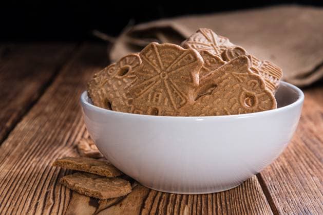 Heap of fresh baked Spekulatius Heap of fresh baked Spekulatius (German cuisine) on wooden background Copyright: xZoonar.com ChristophxSchönex 20084554