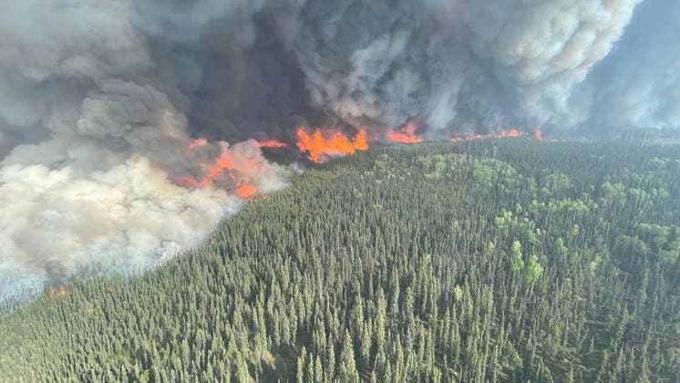 (230609) -- BRITISH COLUMBIA (CANADA), June 9, 2023 -- Undated aerial photo provided by on June 9, 2023 shows wildfires burning in Northeast region of British Columbia, Canada. With more than nine million acres of land burnt, over 20,000 residents evacuated and at least 400 fires still active, half of which are believed out of control, a staggering series of figures revealed on Wednesday by Canadian Minister of Emergency Preparedness Bill Blair showed that the country is facing an unprecedented battle against the raging wildfires. There were ten new wildfires burning in Canada on Friday, bringing the total number of wildfires in the country so far this year to 2,405, the Canadian Interagency Forest Fire Centre said. ( Handout via Xinhua)