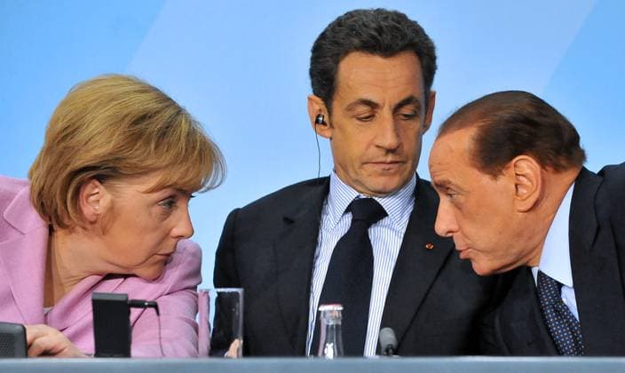 ***FILE PHOTO*** L-R German Chancellor Angela Merkel, French President Nicolas Sarkozy and Italian Prime Minister Silvio Berlusconi talk during a press conference during the preparatory summit of the European part of the Group of Twenty (G20) ahead of the G20 summit in London in April on the state of the financial markets and the world economy, in Berlin, Germany, on February 22, 2009. (CTKxPhoto MichalxDolezal) CTKPhotoF200902230278001  CTKPhotoF200902230278001