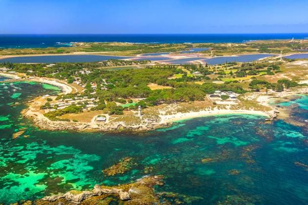 Rottnest Island aerial Aerial view of Bathurst Lighthouse and Pinky Beach in Rottnest Island, Australia, on a sunny day. Scenic flight over famous tourist destination of Western Australia. Indian Ocean with reef. Copy space Copyright: xZoonar.com BENEDETTAxBARBANTIx 12208520