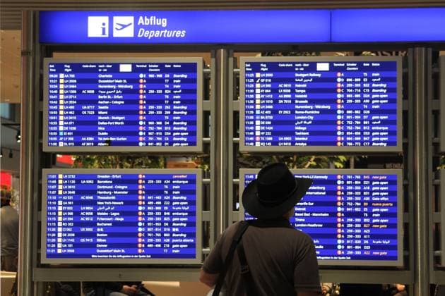 (230614) -- FRANKFURT, June 14, 2023 -- A man browses a bulletin of flight information at an international airport in Frankfurt, Germany, June 12, 2023. A massive NATO exercise that kicked off on Monday is set to cause major disruptions to passenger flights in Germany, raising concerns from air travellers and also protesters. Shan Weiyi) GERMANY-FRANKFURT-NATO EXERCISE-CONCERNS DanxWeiyi 