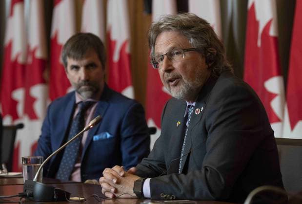 June 14, 2023, Ottawa, ON, Canada: Minister of Environment and Climate Change Steven Guilbeault looks on as Senator Stan Kutcher speaks during a news conference, in Ottawa, Wednesday, June 14, 2023. Ottawa Canada  - ZUMAc35_ 20230614_zaf_c35_018 Copyright: xAdrianxWyldx