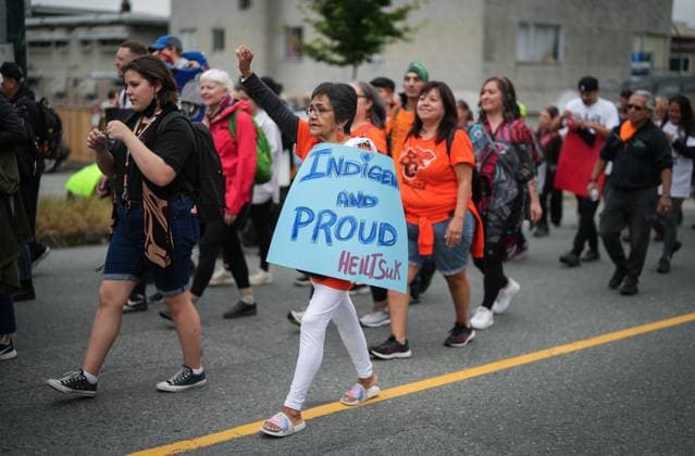 June 21, 2023, VANCOUVER, BC, CANADA: Dorothy Brown, of the Heiltsuk Nation, raises her fist during a friendship walk to a National Indigenous Peoples Day gathering, in Vancouver, B.C., Wednesday, June 21, 2023. VANCOUVER CANADA - ZUMAc35_ 20230621_zaf_c35_090 Copyright: xDarrylxDyckx