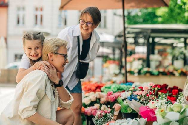 Happy daughter enjoying with lesbian couple at flower shop model released, Symbolfoto, VSNF01000