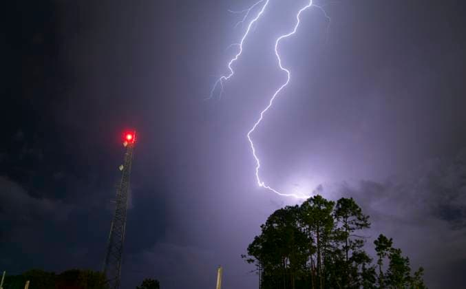 Atlantic Seaboard Thunderstorm Electrical Storm Strikes Lightpost An electrical storm producing ground to cloud lightning on a warm summer night in the eastern United States Copyright: xZoonar.com ChristopherxBoswellx 12563957