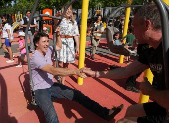 June 23, 2023, MONTREAL, PQ, CANADA: Prime Minister Justin Trudeau, jumps on a swing while Minister of Foreign Affairs Melanie Jolie looks on prior to attending a Fete nationale du Quebec event on Friday, June 23, 2023 in Montreal. MONTREAL CANADA  - ZUMAc35_ 20230623_zaf_c35_061 Copyright: xChristinnexMuschix