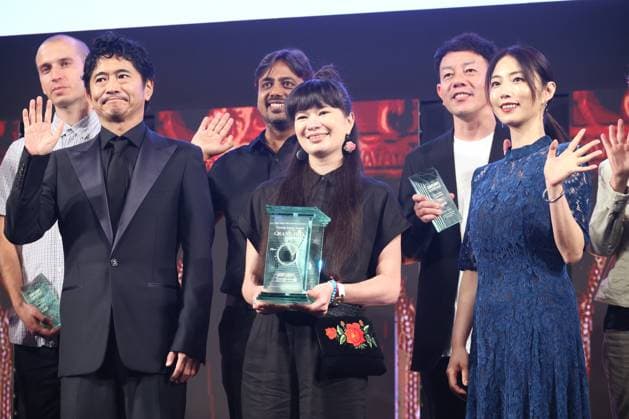 June 26, 2023, Tokyo, Japan - Poland based Japanese animation artist Izumi Yoshida (C) holds the trophy of the George Lucas award at the awarding ceremony of the Short Shorts Film Festival & Asia 2023 in Tokyo on Monday, June 26, 2023, actor Masato Hagiwara (L) and actress Megumi (R) smile. Yoshida won the George Lucas award, grand prix of the film festival for her short animation movie The Bridge . (photo by Yoshio Tsunoda AFLO)  , aflo_222753583.jpg,