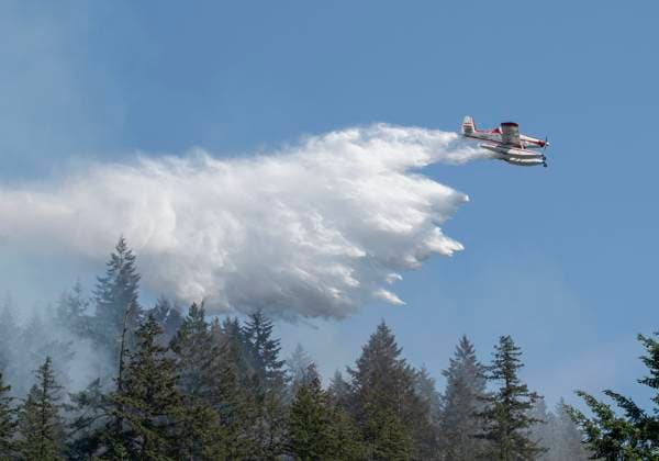 June 26, 2023, Vancouver, BC, Canada: Air tankers drop water on a brush fire burnng near Whyte Lake in West Vancouver. The fire burned about 3 hectares by late afternoon and forced the closure of Highway 99 in both directions. Vancouver Canada - ZUMAh13_ 20230626_zaf_h13_002 Copyright: xPJxHellerx