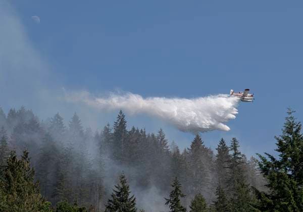 June 26, 2023, Vancouver, BC, Canada: Air tankers drop water on a brush fire burnng near Whyte Lake in West Vancouver. The fire burned about 3 hectares by late afternoon and forced the closure of Highway 99 in both directions. Vancouver Canada - ZUMAh13_ 20230626_zaf_h13_003 Copyright: xPJxHellerx