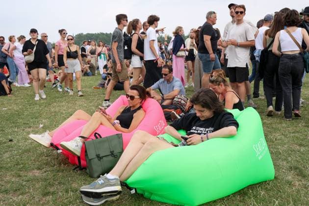 Illustration picture shows fans sitting on a blown bag during the first day of the Rock Werchter music festival in Werchter, Thursday 29 June 2023. The 47th edition of the festival is taking place from 29 June to 2 July.  VIRGINIExLEFOUR 69686223