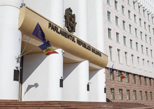 Moldova Airport Shooting Mourning 8471995 04.07.2023 A Moldovan flag is lowered to half-mast next to a flag of European Union on the facade of the Parliament s building on a day of national mourning for security officers who were killed in the shooting incident at the Chisinau airport on June 30, in Chisinau, Moldova. Tajikistan citizen Rustam Ashurov had just opened fire on two airport staff after being denied entry into the country. Rodion Proca Sputnik Chisinau Moldova  Copyright: xRodionxProcax