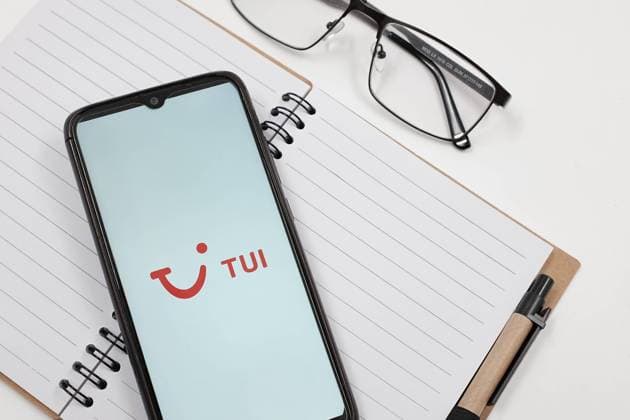 Airlines Logo Photo Illustration In this photo illustration a TUI airlines logo is displayed on a smartphone screen above a notebook next to glasses and a pen in Athens, Greece on July 5, 2023. (Photo illustration by Nikolas Kokovlis NurPhoto) Athens Greece  Copyright: xNikolasxKokovlisx originalFilename: kokovlis-notitle230705_npMjn.jpg