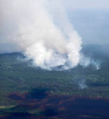 July 5, 2023, Lebel-sur-Quevillon, PQ, Canada: A smoke plume is seen rising from the forest south of Lebel-sur-Quevillon, Que., Wednesday, July 5, 2023. Lebel-sur-Quevillon Canada  - ZUMAc35_ 20230705_zaf_c35_061 Copyright: xAdrianxWyldx