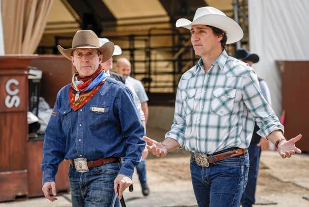 July 7, 2023, Calgary, AB, CANADA: Prime Minister Justin Trudeau, right, and Stampede executive Will Osler walk the grounds of the Calgary Stampede in Calgary, Friday, July 7, 2023. Calgary CANADA  - ZUMAc35_ 20230707_zaf_c35_058 Copyright: xJeffxMcintoshx