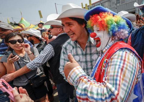 July 7, 2023, Calgary, Alberta, Canada: Canadian Prime Minister Justin Trudeau, 51, center, walks the grounds of the Calgary Stampede in Calgary. Calgary Canada  - ZUMAc35_ 20230707_zaf_c35_053 Copyright: xJeffxMcintoshx