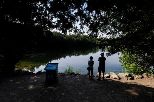 July 7, 2023, MILTON, ON, Canada: People look out on the water from the shore of Crawford Lake in Milton, Ont., on Friday, July 7, 2023. MILTON Canada  - ZUMAc35_ 20230707_zaf_c35_136 Copyright: xColexBurstonx