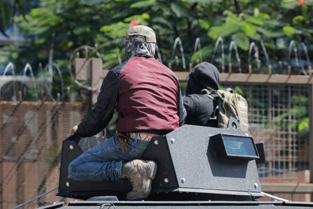 July 11, 2023, Chilpancingo, Guerrero, Mexico: Demonstrator mounted on an armoured truck that was seized from the National Guard, called Black Mamba and used by the special forces of the capital. Chilpancingo Mexico - ZUMAs310 20230711_zip_s310_010 Copyright: xLuisxExSalgadox