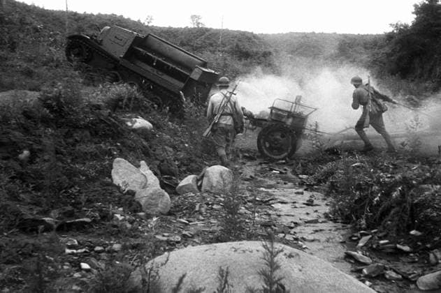 TWO SOLDIERS CRAWLER-TRANSPORTER STREAM 369 10.08.1944 Soviet soldiers crossing a stream on their way to a new firing position. The Karelian Front. Dmitriy Kozlov Sputnik Medvezhegorsk Karelo-Finnish SSR USSR  Copyright: xDmitriyxKozlovx